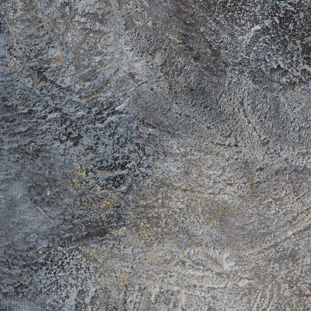 Close-up of a textured stone surface with gray and brown tones.