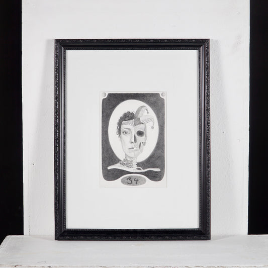 Realist pencil drawing of a face with elements of realism and abstract art, presented in a black frame.